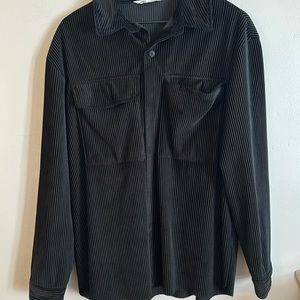 Jet black jacket with black buttons.